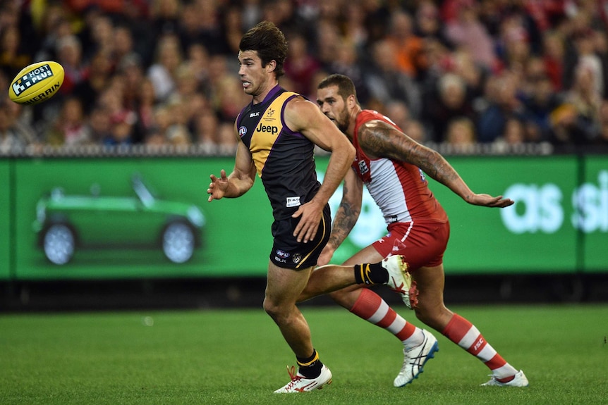 Richmond's Alex Rance (L) and Sydney's Lance Franklin contest the ball at the MCG.