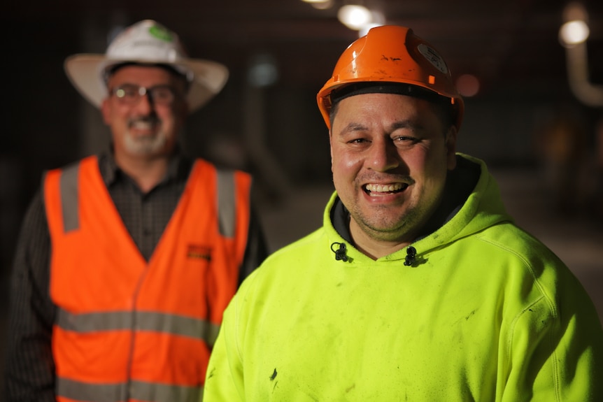 A man in a hard hat on a construction site.