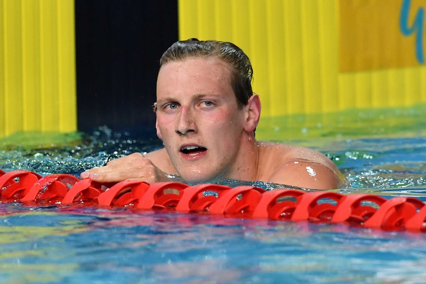 Mack Horton next to the lane rope at the end of the men's 400 metres freestyle final at the national swimming championships.