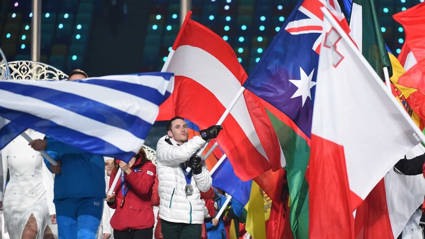 David Morris carried the Australian flag at the closing ceremony of the Winter Olympics
