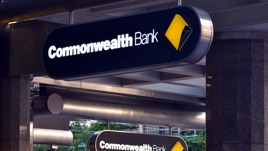 Commonwealth Bank signs hang from a Brisbane building