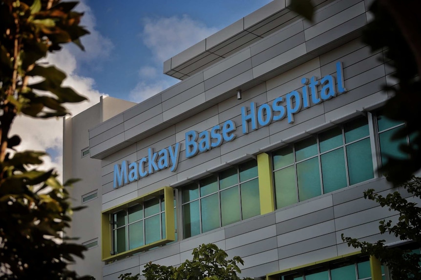 A multi-storey building bearing the lettering "Mackay Base Hospital".