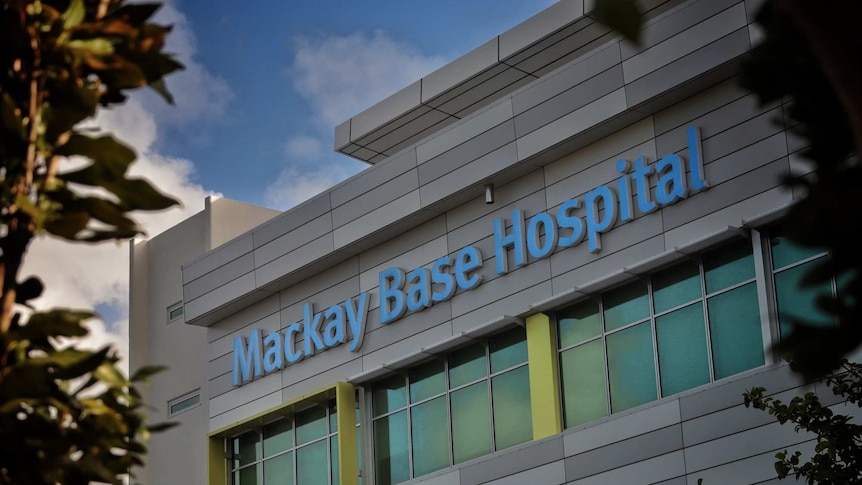 A multi-storey building bearing the lettering "Mackay Base Hospital".
