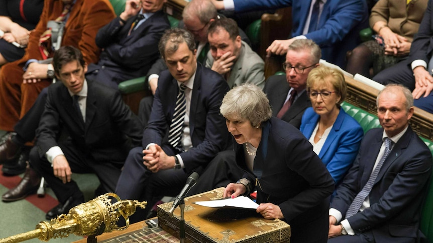 MPs watch on as Theresa May speaks in Parliament