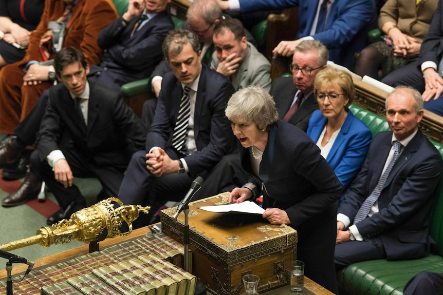 MPs watch on as Theresa May speaks in Parliament