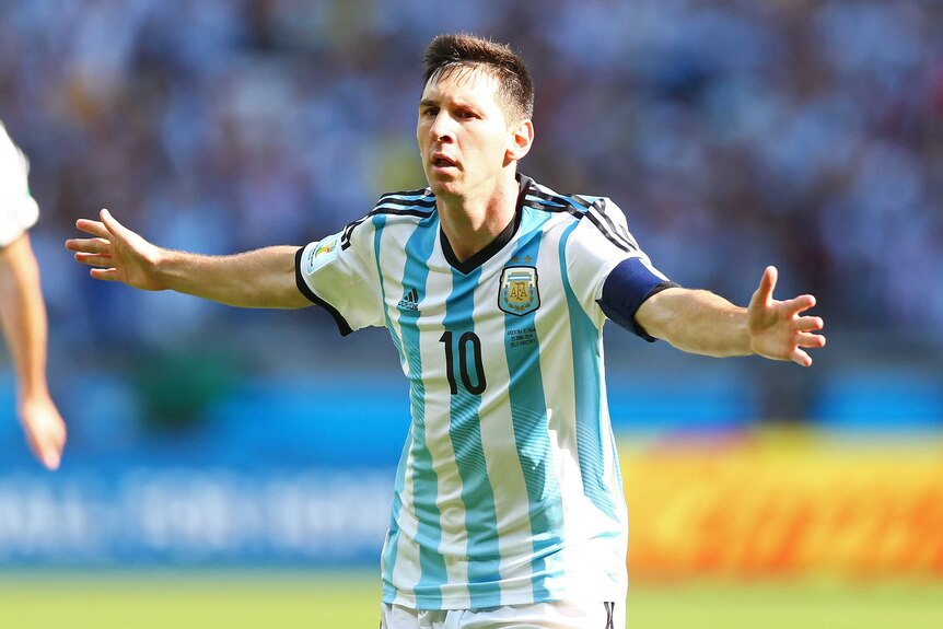 Lionel Messi celebrates his late goal for Argentina against Iran