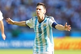 Lionel Messi celebrates his late goal for Argentina against Iran