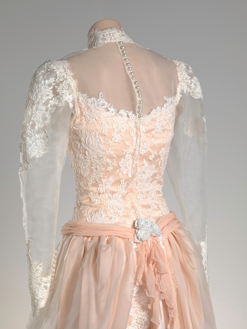 a wedding dress from the back, consisting of lace and pearls