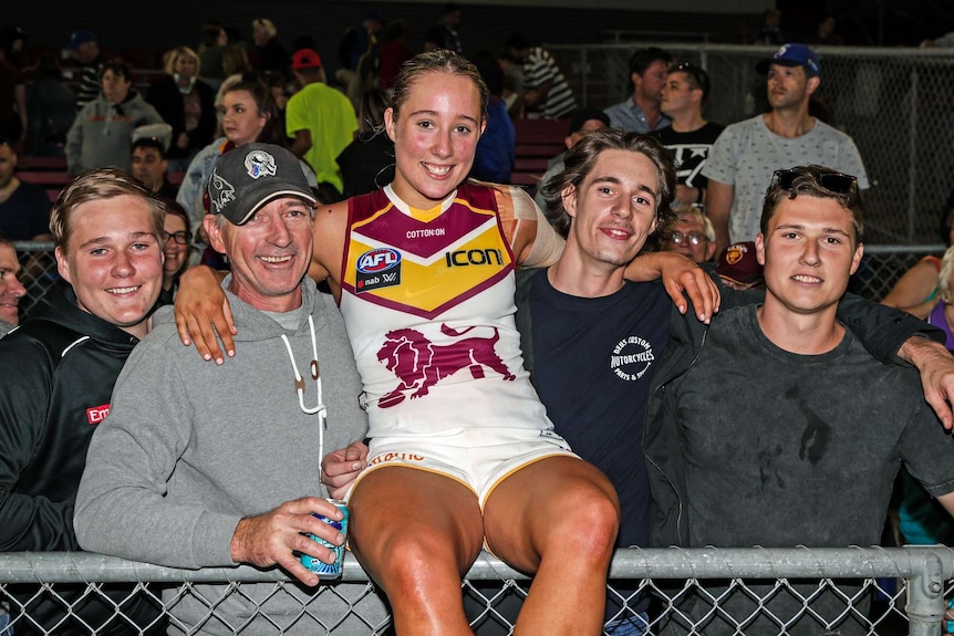 Jacqui and her father and three brothers.