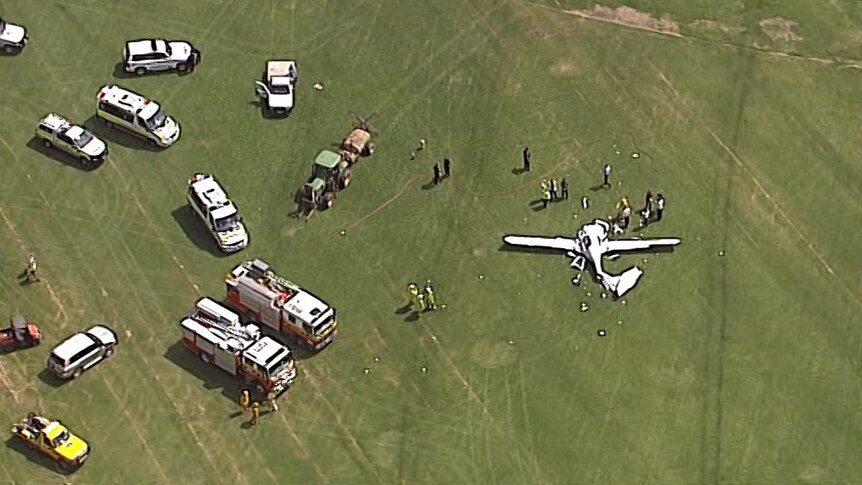 Emergency crews at the scene of a plane crash near Jimboomba.