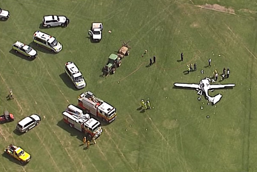 Emergency crews at the scene of a plane crash near Jimboomba.