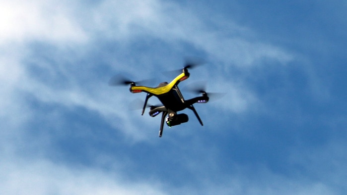 A drone hovers in the sky above Darwin.