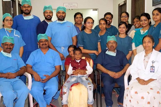 The boy with doctors from Saveetha Dental College and Hospital