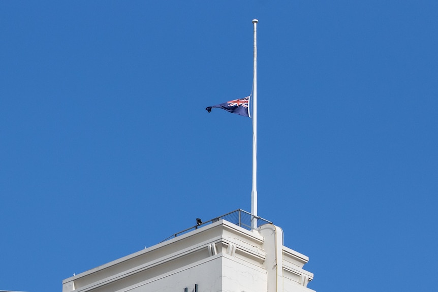 A half-mast Australian flag.