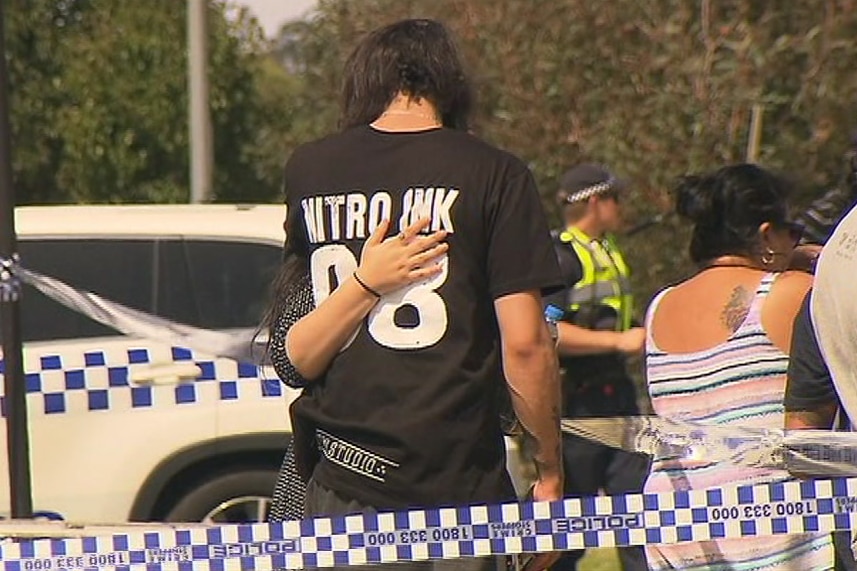 Witnesses to a shooting at a Hampton Park tattoo parlour comfort each other.
