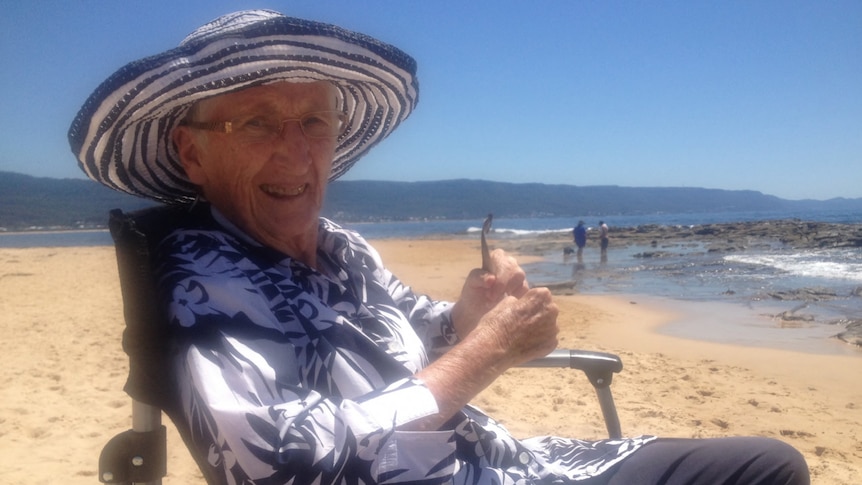 Shirley Fowler sits in a wheelchair at the beach.