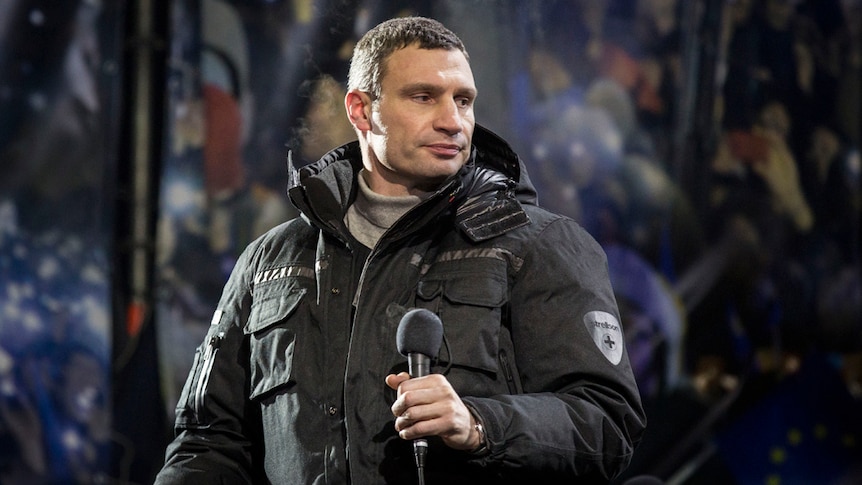Ukraine opposition leader Vitali Klitschko speaks to anti-government protestors on January 25, 2014 in Kiev