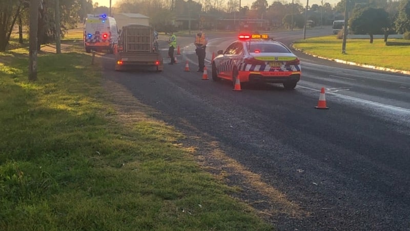 Highway patrol police stop vehicle.