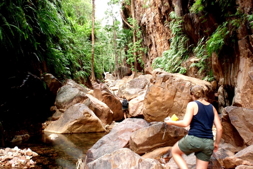 People climb a gorge in the Kimberley.