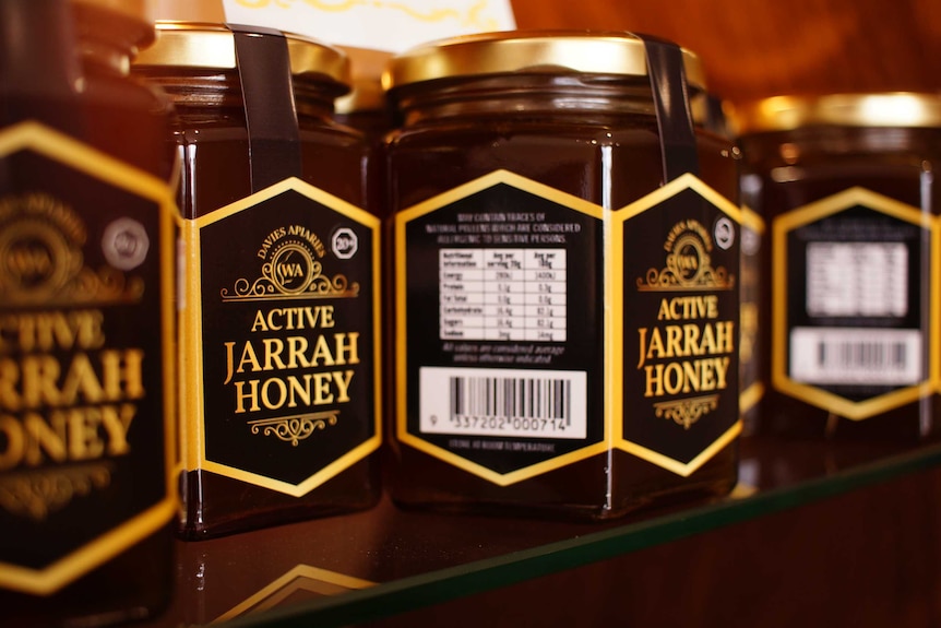 Jars of Davies apiaries active jarrah honey sit on a shelf