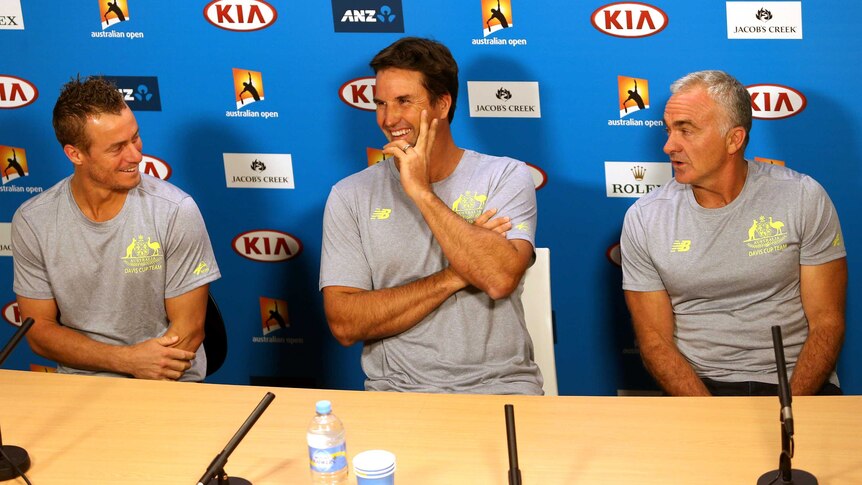 Change of roles ... Lleyton Hewitt (L) alongside Pat Rafter (C) and Wally Masur at their media conference