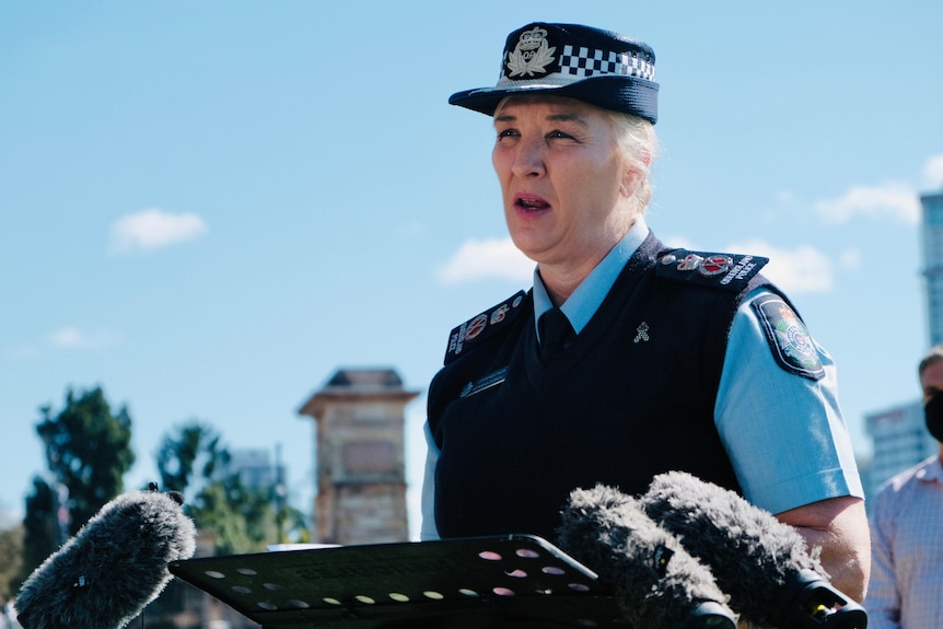 Qld police commissioner Katarina Carroll speaks into microphones.