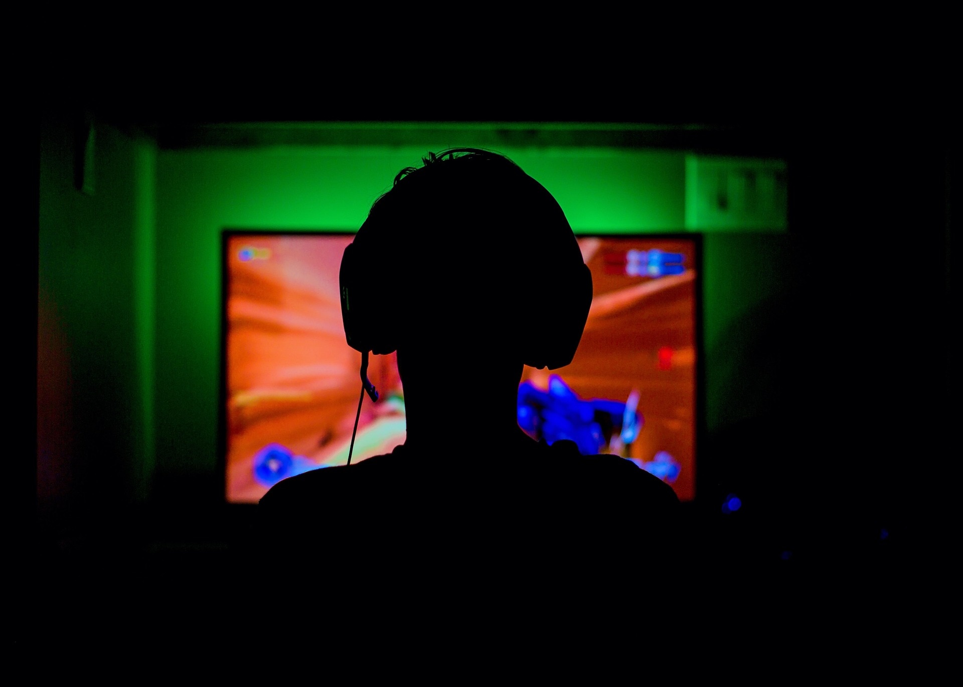 Silhouette of a gamer&#x27;s head as they play video games