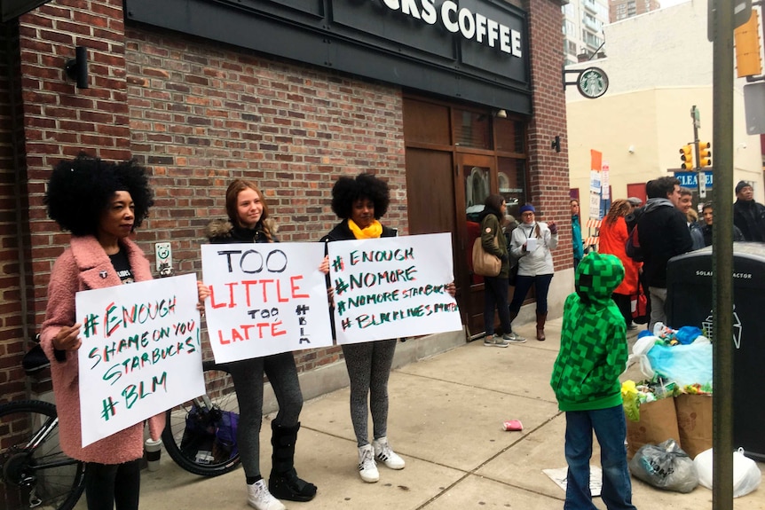 Protesters gather outside a Starbucks in Philadelphia
