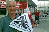 Peter Robertson from the Wilderness Society protesting outside Woodside's AGM.