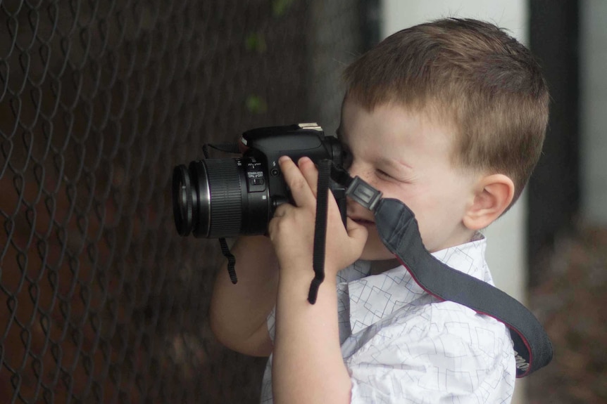 Max Pritchard holds the camera up to his face