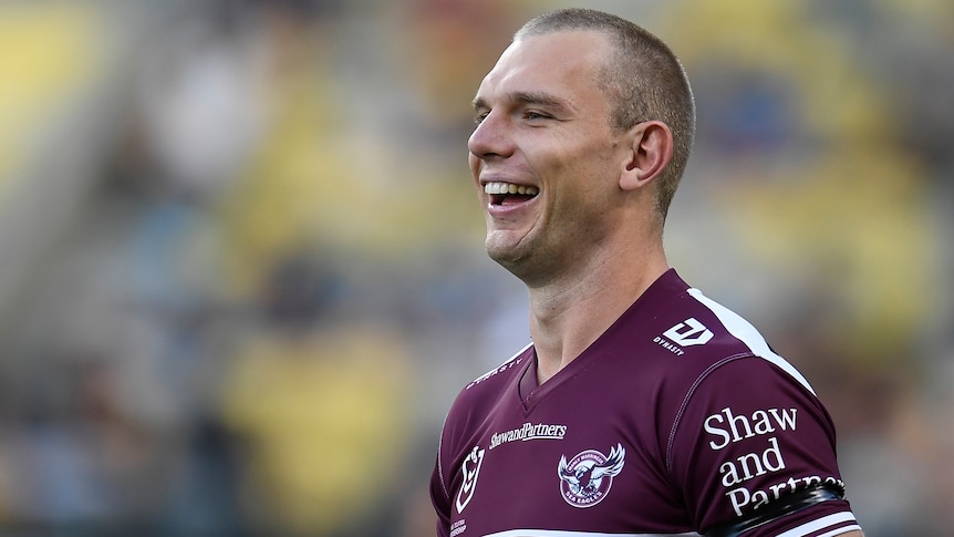 Head shot of man smiling during a rugby league match