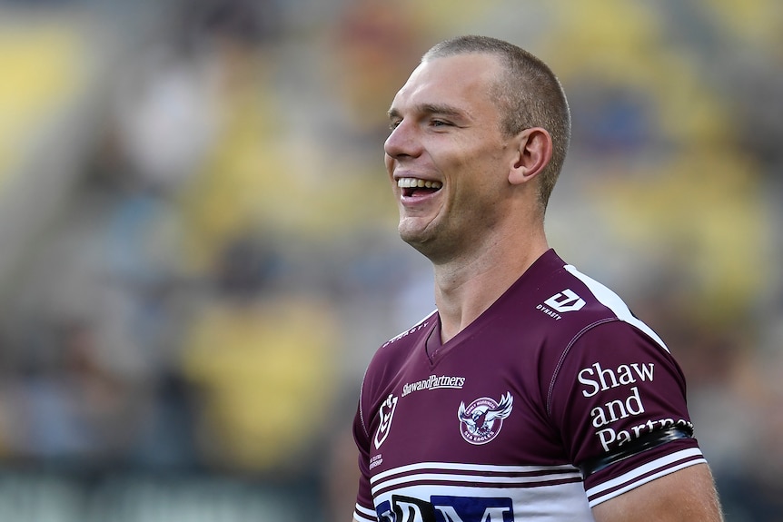 Head shot of man smiling during a rugby league match