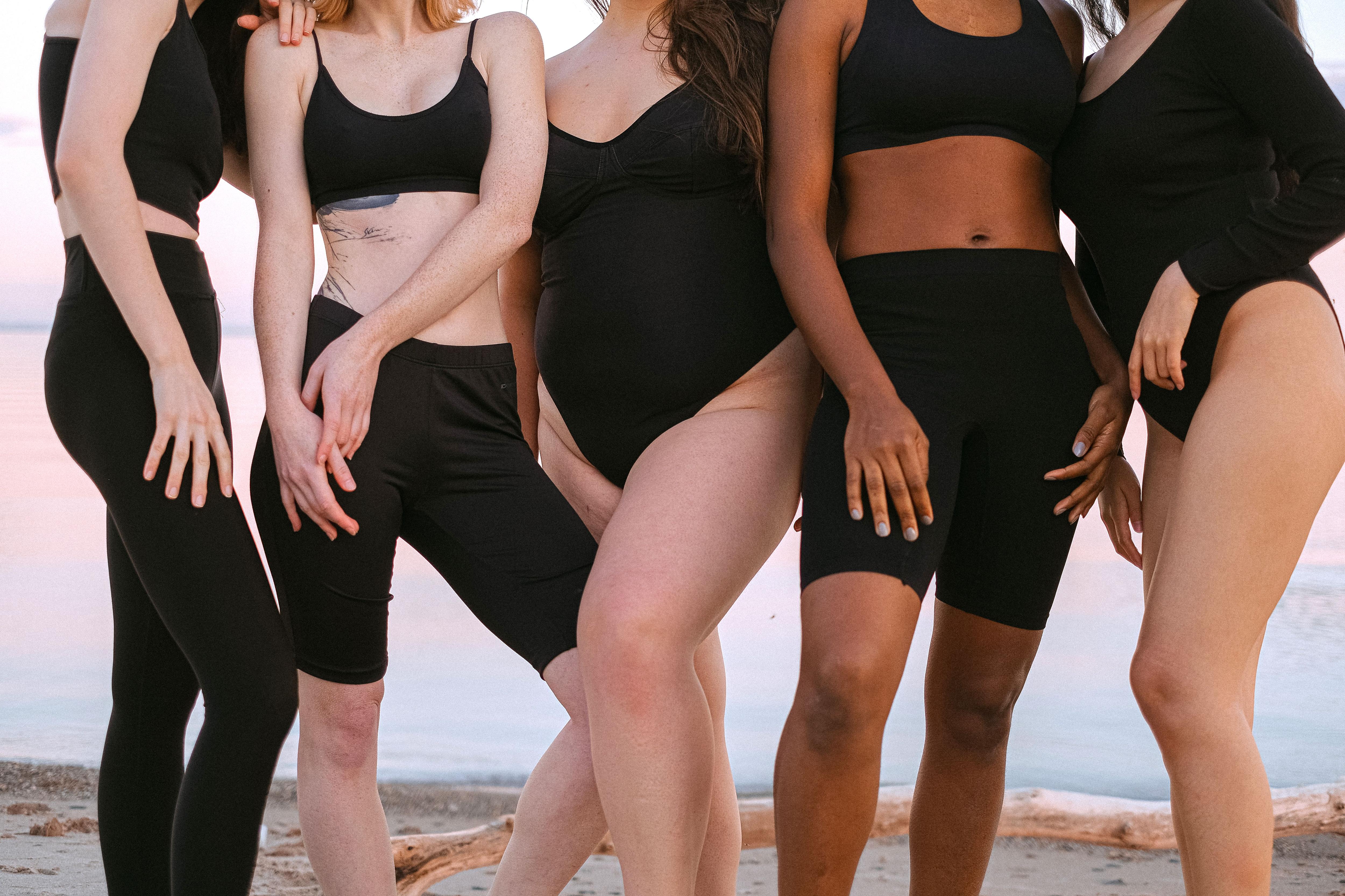close up of female models on the beach in activewear