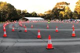 A marquee with a large number of orange cones 