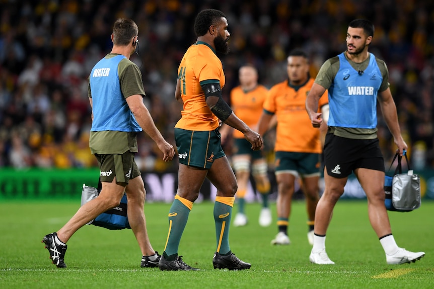 A Wallabies player leaves the field after being sent off against France.