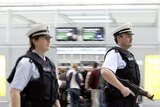 German police officers patrol the departure area of Munich's airport