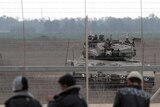An Israeli army tank in position along border with Gaza