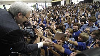 Kevin Rudd is greeted by students at Nambour High School in Queensland on November 13, 2007. Mr Rudd attended the school as a...