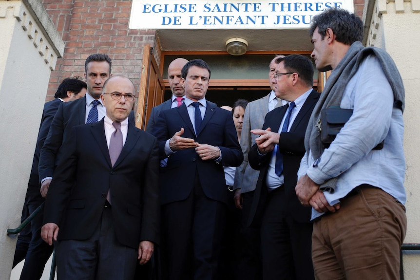 French politicians leave the Sainte Therese de l'Enfant Jesus church in Villejuif near Paris