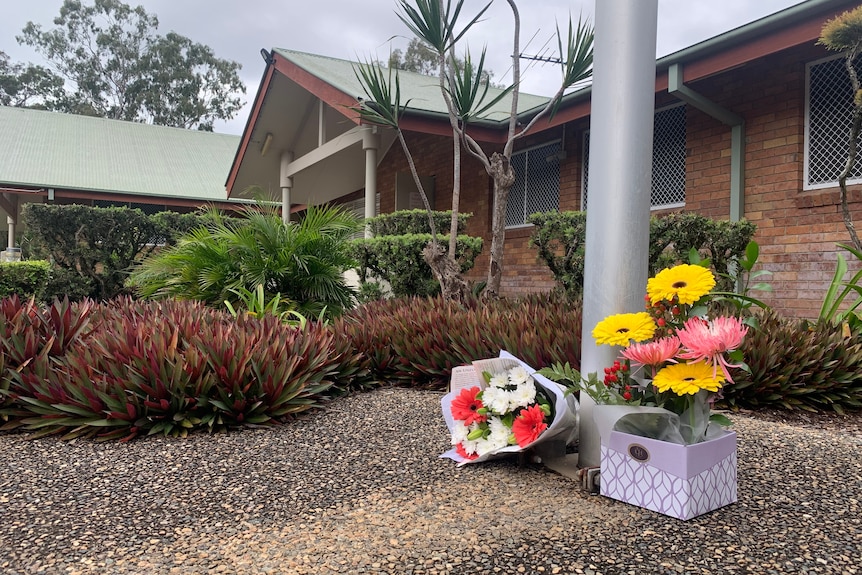 Floral tributes laid at a police station.