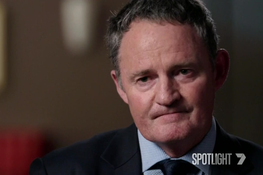 Steve Whybrow looks serious, wearing a suit and tie and collared shirt. The camera only takes in his face and shoulders.