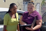 Aboriginal community worker Rose Butcher (left) speaks to child protection case worker Chanel Baily