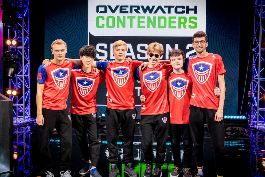 Overwatch League team Washington Justice stand with their arms around one another for a photo at the Melbourne Esports Open.