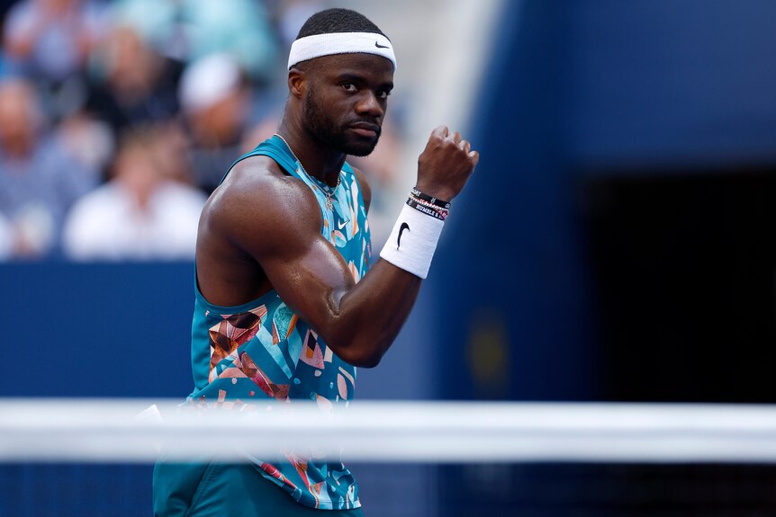 Frances Tiafoe clenches his fist during a US Open tennis match.