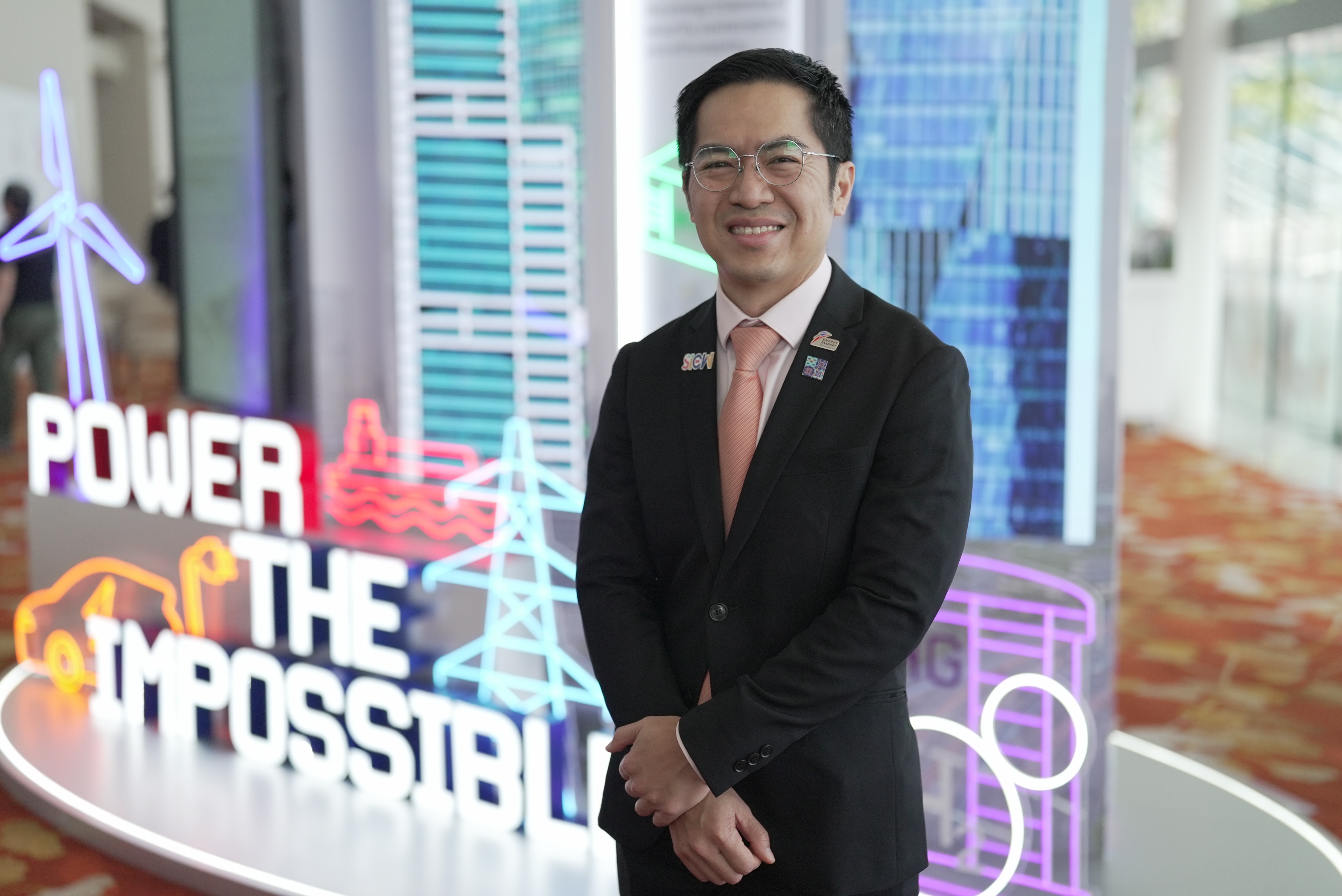 Puah Kok Keong, a smiling man in a dark suit.