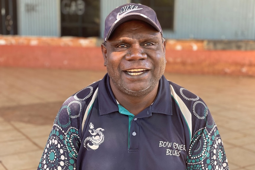 Indigenous man smiles to camera