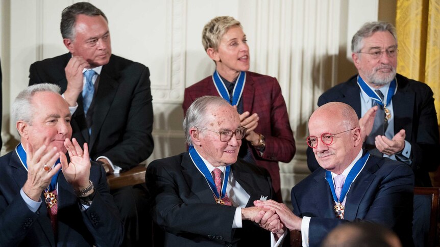 6 of the recipients, including ellen degeneres and robert deniro applaud as they watch the ceremony.