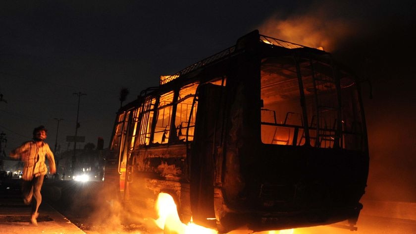 More than 100 people were wounded and dozens of vehicles and shops torched
