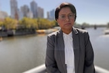 Labor MP Kaushaliya Vaghela standing with the Yarra River and Melbourne CBD behind her.