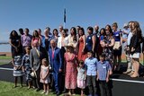 People who have been granted citizenship at the Australia Day citizenship ceremony in Canberra along side Malcom Turnbull
